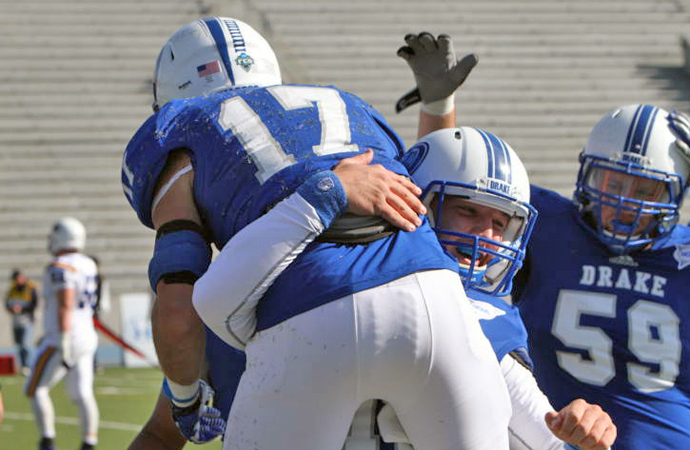Drake's Nick Rosa celebrates with his teammates following a touchdown at Morehead State, Saturday.